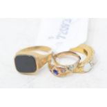 A 9ct gold and hardstone signet ring, and two other rings (3)