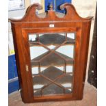 A glazed mahogany corner cupboard, 68 cm wide