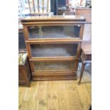 A Globe Wernicke oak three section bookcase, with a drawer below, 87 cm wide