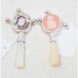 A silver and mother of pearl rattle, and another similar (2)