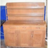 An Ercol style elm dresser and plate rack, 122 cm wide Report by GH Couple of ring marks and some