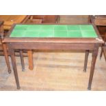 A Liberty style oak table, with a tile inset top, 102 cm wide
