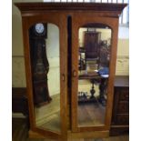 A Victorian satin birch wardrobe, with a pair of mirrored doors, 148 cm wide