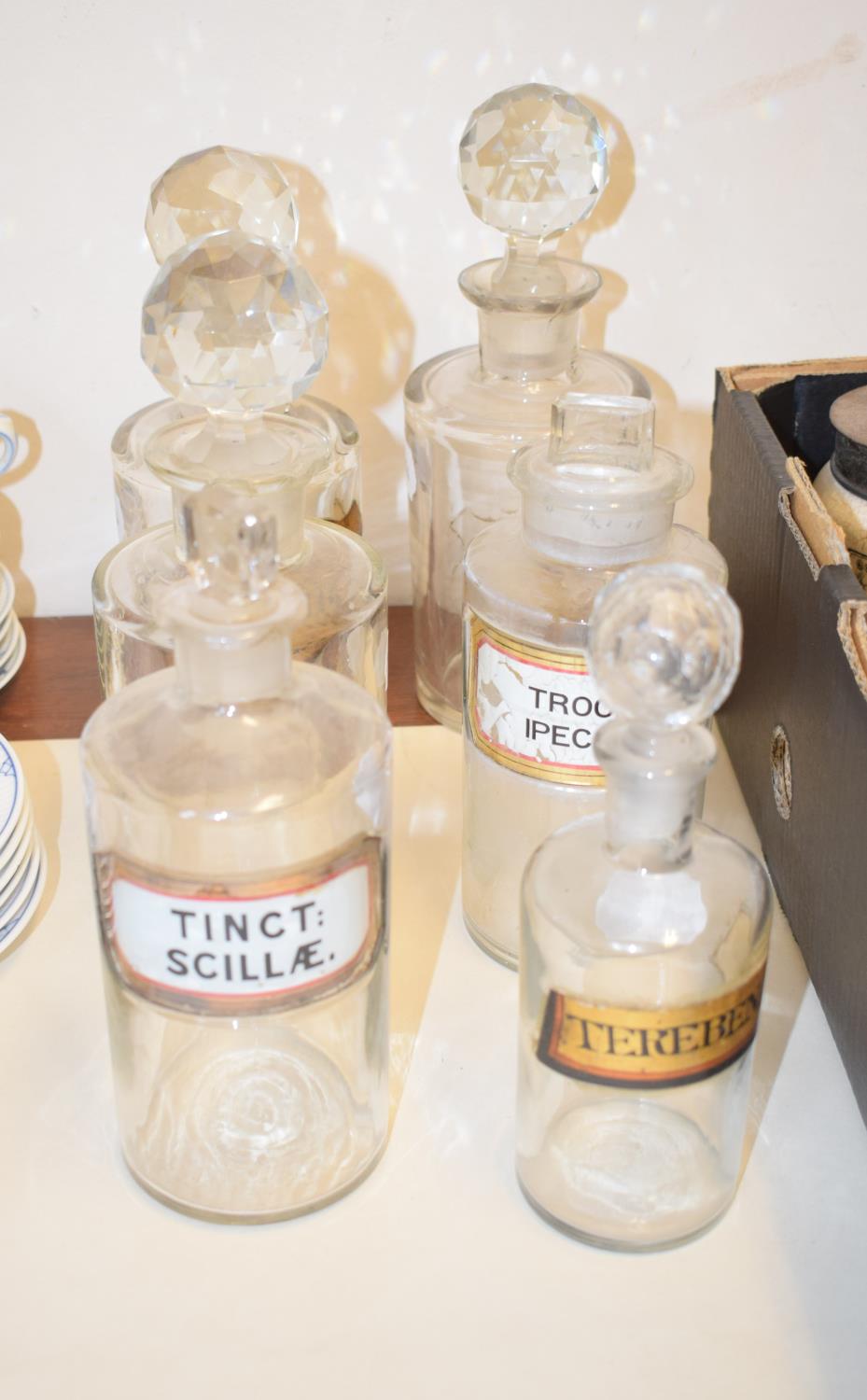 A set of six Victorian/Edwardian clear glass apothecary bottles, with gilt labels and cut glass - Image 2 of 2