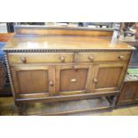A carved oak coffer, 90 cm wide, the interior containing a large quantity of 78 rpm records with