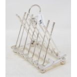 A novelty silver plated golfing toast rack, 16 cm wide Modern