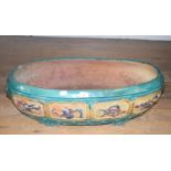 A Chinese earthenware jardiniere, of rounded rectangular form, decorated various motifs, 78 cm