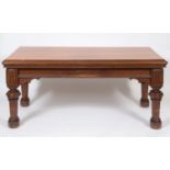 A late Victorian gothic style pine table, on carved and tapering legs, 183 cm wide See illustration