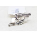 A pair of silver and mother of pearl pistol cufflinks Report by RB Modern
