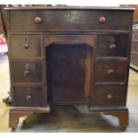 A George III style mahogany kneehole desk, 82 cm wide, and an Edwardian marble top washstand (2)