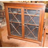 A two door bookcase, with adjustable shelves, 114 cm wide