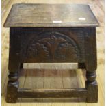 An oak box top stool, carved foliage, 48 cm wide