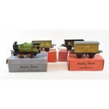A Hornby Series 0 gauge clockwork locomotive, 0-4-0, 9N, a Wagon No 1, another Wagon and a Banana