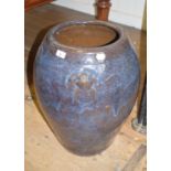 A large Chinese earthenware vase, of ovoid form, with a blue glaze, 57 cm high