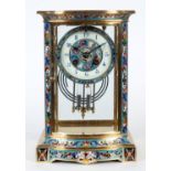 A mantel clock, the 9 cm diameter dial with Arabic numerals, fitted an eight day movement,