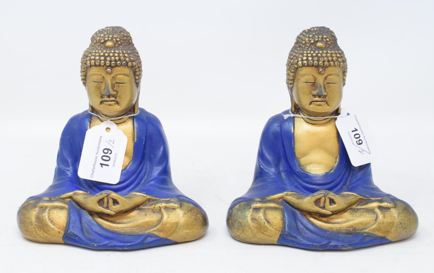 A pair of seated Buddhas, painted blue and in gilt, 15 cm high (2) Modern