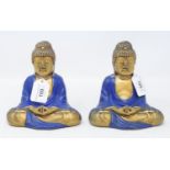 A pair of seated Buddhas, painted blue and in gilt, 15 cm high (2) Modern