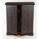 A 19th century carved oak table cabinet, with a fitted interior, 31 cm wide