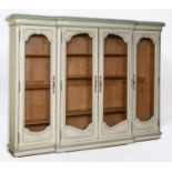 A French breakfront cabinet, with painted decoration, having a pair of doors with wire grills,