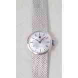 A lady's 18ct white gold wristwatch, with baton indices, in a Garrard box Report by RB Approx. 25.