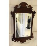 A George III style fret carved mahogany wall mirror, 42.5 cm wide