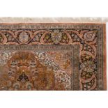 A large silk carpet, decorated flowers and foliage, approx. 310 x 220 cm See illustration