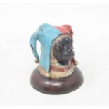 A novelty painted bronze jester pug inkwell, 8 cm high Modern
