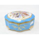 A Sevres style porcelain box, decorated musical instruments, 20 cm wide Modern