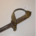 A Victorian naval officer's sword, with a wire bound fishskin grip and lion head pommel Lacks