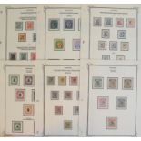 A group of Tanganyika stamps, an unused GV collection on leaves with 1916 N.F. set, 1917 GEA to 10r,