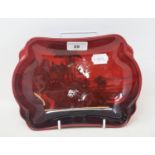 A Royal Doulton Flambe dish, decorated a farmhouse scene, 8808, signed Noke to base, 23 cm wide