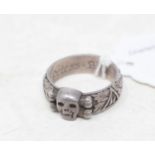 An SS totenkopf style ring, engraved, of post war manufacture