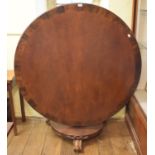 A Victorian mahogany centre table, on an octagonal baluster column, 131 cm diameter