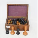 A carved wood chess set, in an inlaid box, 18 cm wide Report by GH One of the black pawns is a