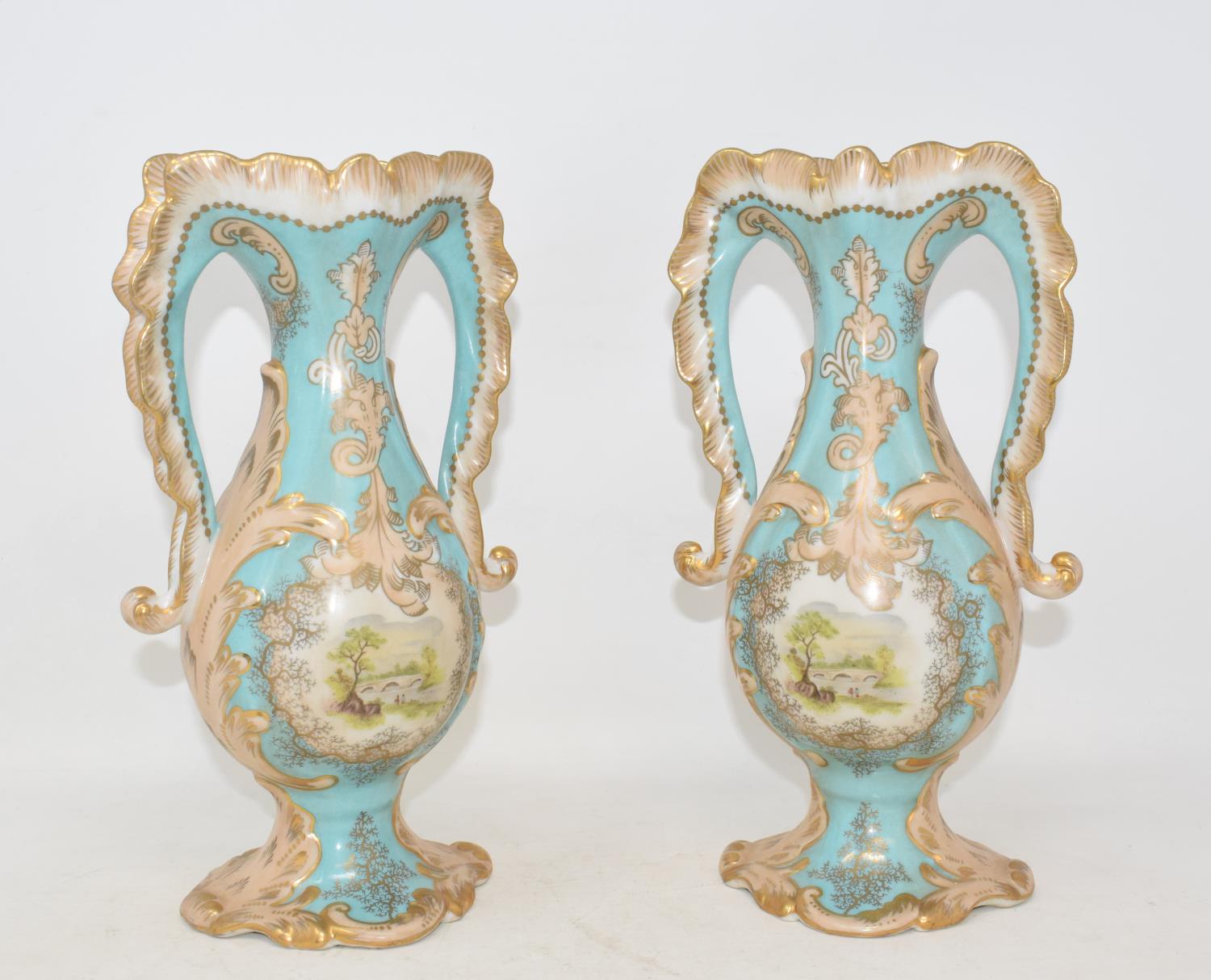 A pair of two handled porcelain vases, each decorated a landscape, 25 cm high (2) Modern