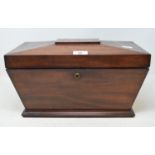 An early Victorian mahogany tea caddy, of sarcophagus form, 39 cm wide