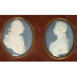 A pair of late 18th/early 19th century Wedgwood Jasperware oval plaques, George III and Queen