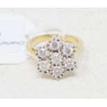 A 9ct gold and diamond flowerhead ring Report by RB Modern