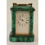 A malachite and brass miniature carriage timepiece, 9.5 cm high Report GH Clock movement appears