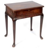 A walnut table, the lift up top above a false frieze drawer, on slender cabriole legs with pad feet,