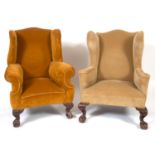 A matched pair of 18th century style wing armchairs, on leaf carved dwarf cabriole legs with claw