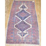 A Caucasian rug, decorated geometric motifs, 195 x 105 cm