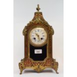A late 19th century French mantel clock, the 9 cm diameter enamel dial with Roman numerals, fitted