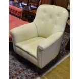 A pair of Victorian button back upholstered armchairs, on turned front legs (2)