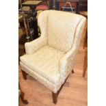 A George III style wingback armchair