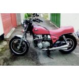 A 1981 Honda CB650CA, registration number VRL 112W, red. This CB650 has only covered 7,800 miles