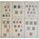 A group of Tanganyika stamps, an unused GV collection on leaves with 1916 N.F. set, 1917 GEA to 10r,