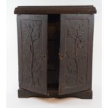 A 19th century carved oak table cabinet, with a fitted interior, 31 cm wide