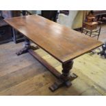 A 17th century style oak refectory table, with a two plank top, 184 cm wide