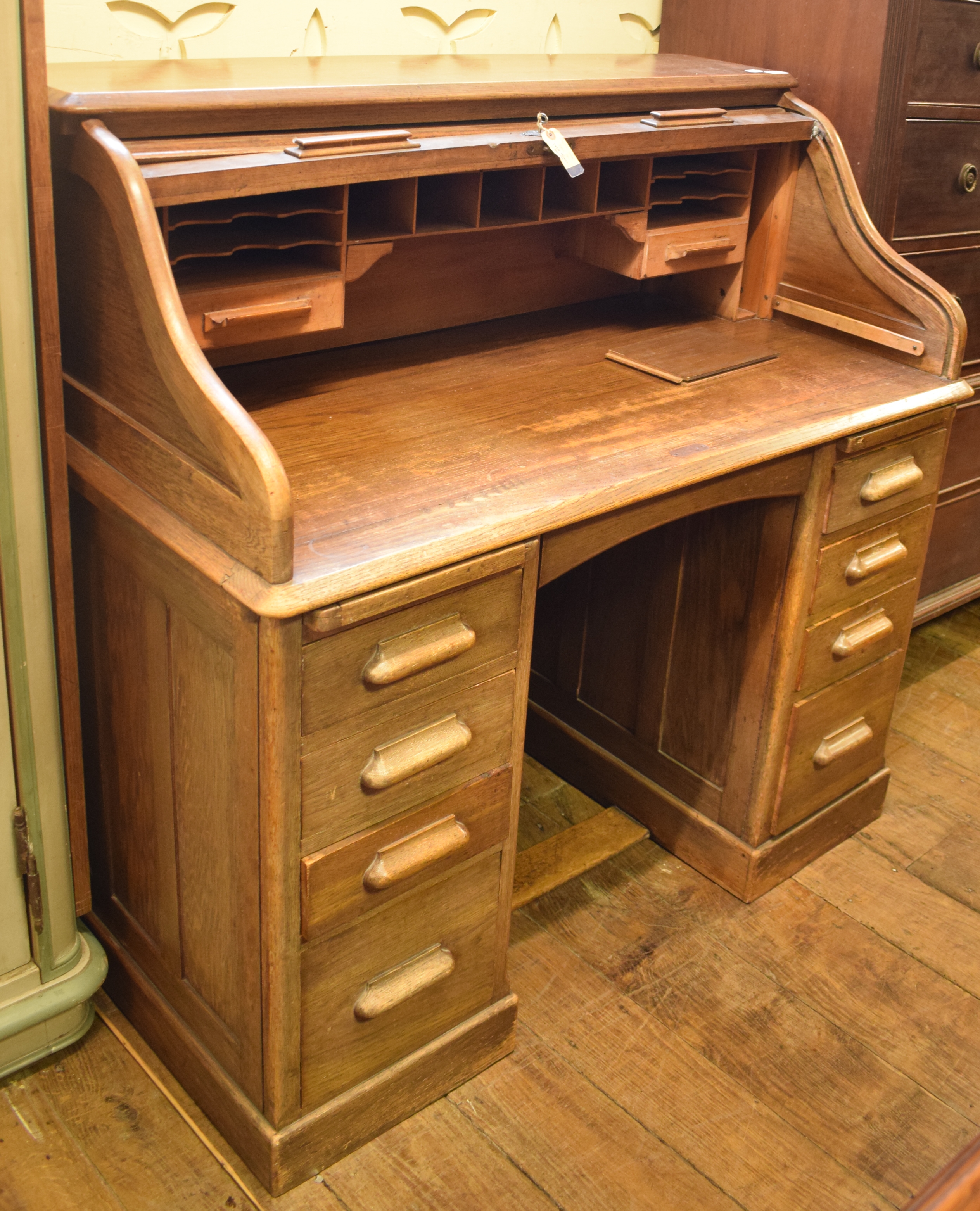 A Lebus oak roll top desk, 121 cm wide